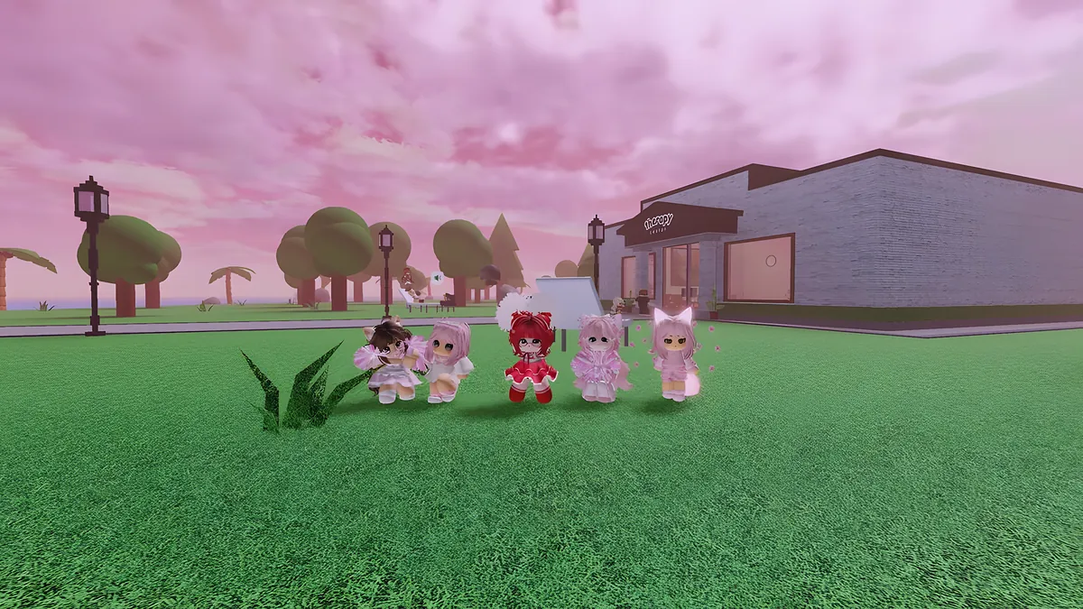 Five friends in pink outfits on a lawn under a pink sky