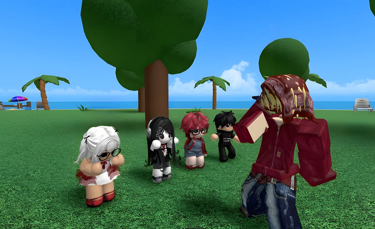 Friends hanging out on the grass by the beach
