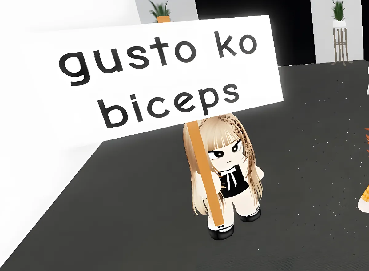 A member holding up a sign that reads gusto ko biceps