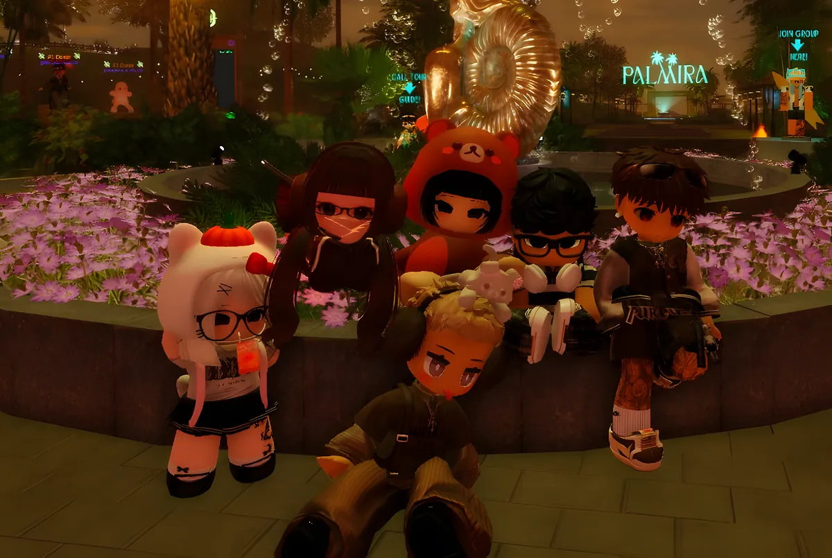 Six friends gathered by a flower-lined fountain at night