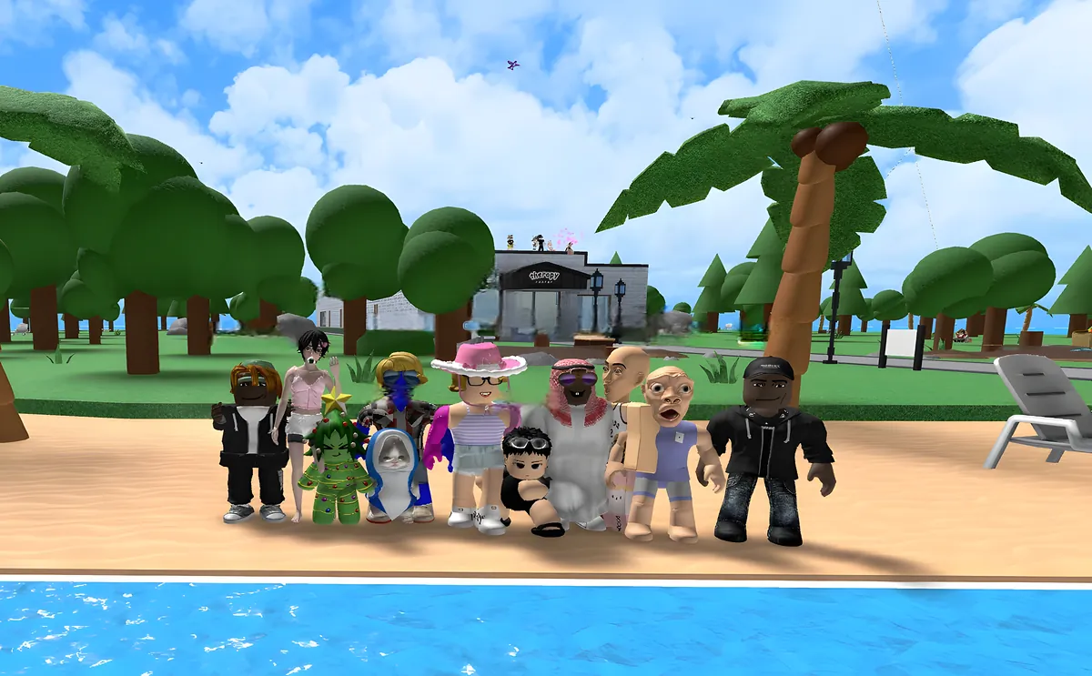 Friends in all kinds of outfits lined up on a sunny beach with palm trees and a small cafe behind them